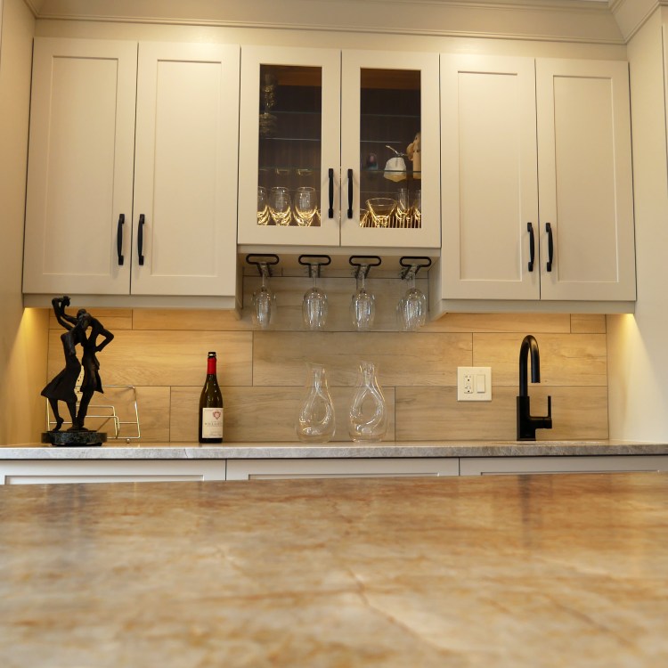 cambria quartz counters with bar area and wine storage